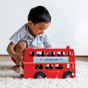 TV469-London-Bus-Boy-Pushing-Red-Vehicle